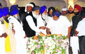 CM Parkash Singh Badal, Deputy CM Sukhbir Badal and Akal Takht Jathedar Giani Gurbachan Singh at the inauguration of Golden Temple entrance plaza in Amritsar on Wednesday