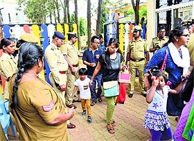 Parents come out after attending a meeting at Orchid International School in Bangalore on Wednesday.