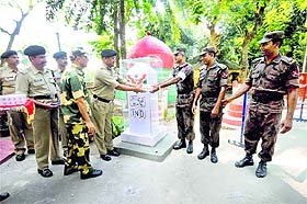 Border Security Force personnel present sweets to Border Guard of Bangladesh personnel on the occasion of Diwali, at the India-Bangladesh Akhaura checkpost in Agartala on Wednesday. 