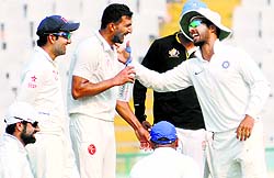 Rishi Dhawan is congratulated by his teammates after he dismissed a Central Zone batsman in the Duleep Trophy semifinal at PCA Stadium in Mohali on Wednesday