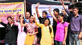 Homoeopathy pharmacists hold a protest in Dehradun on Wednesday. 