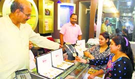 Women purchase jewellery before Diwali at a showroom in Amritsar.