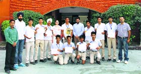 Basketball players of Spring Dale Senior School along with the school staff in a jubilant mood in Amritsar on Friday.