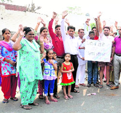 Residents of Paras Ram Nagar protest against the MCB in Bathinda on Friday.
