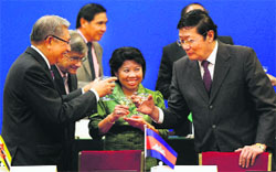 Chinese Finance Minister Lou Jiwei (R) toasts with guests during the signing ceremony of the Asian Infrastructure Investment Bank at the Great Hall of the People in Beijing on Friday. AP/PTI