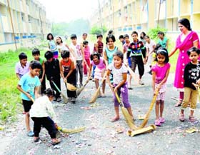 Children remove the cracker debris at the Air Force Colony in Sector 47, Chandigarh, on Friday. 