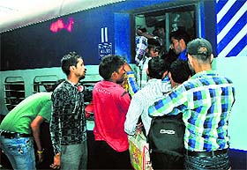 Passengers rush to board the overcrowded Lucknow-Chandigarh Express at Chandigarh railway station on Friday. 