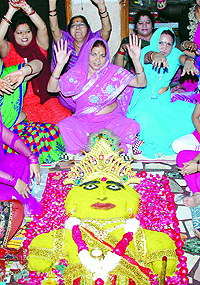 Devotees participating in Govardhan Pooja, organised by the Yuva Sanskritik Sangathan at Ghantaghar in old Delhi on Friday