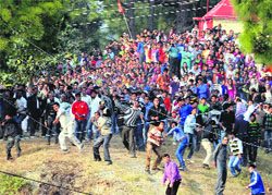 People participate in the traditional Pathar Mela at Dhami near Shimla on Friday. Photo: Amit Kanwar