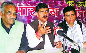 BJP state president and MP Jugal Kishore Sharma addresses a press conference at the party headquarters in Jammu on Friday. 