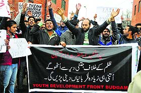 Activists of the Kashmiri Shiite Youth Development Front, Budgam, raise anti-government slogans during a protest in Srinagar on Friday. 