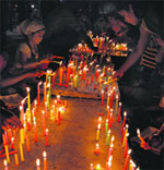 Devotees light candles at Gurdwara Dukhnivaran Sahib on the occasion of Diwali. 
