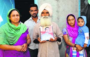Anxious wait: Gobinder Singhs family at their village Murar in Kapurthala district. 