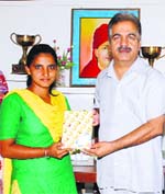 PU senator SK Arora honours a winner in Jalandhar on Friday