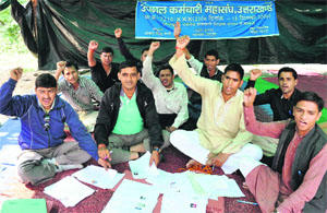 UPNL workers protest at Parade Ground in Dehradun on Friday.