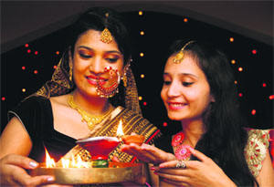 Residents light lamps on Diwali in Dehradun on Thursday.