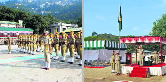 ITBP jawans present a ceremonial guard of honour; (Right) A commandant takes salute at the Raising Day parade at the ITBP headquaters at Jajerdewal in Pithoragarh on Friday. 