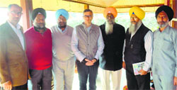 SGPC officials with J&K CM Omar Abdullah in Srinagar. Tribune photo