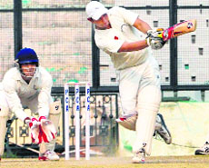 Central Zones Mahesh Rawat plays a shot against North Zone  during their semifinal in Mohali on Saturday.