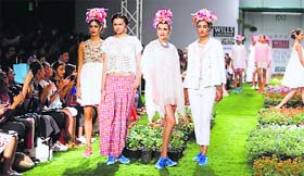 Aneeth Arora decorated the ramp with green grass and flowers for her show at India Fashion Week Spring-Summer 2015