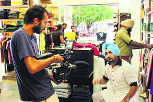 Atharv baluja (L) directs a scene from Ravinder Grewals track Truck