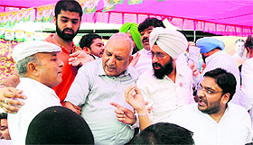 Congress workers argue with one another at the installation ceremony of the Ludhiana DCC (urban) president at the party office in Ludhiana on Sunday.