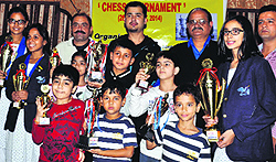 The winners of the chess tournament organised by the Doon Chess Club at with the trophy at Doon Club in Dehradun on Sunday