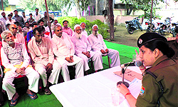 SSP Sweety Aggarwal at a meeting with local villagers in Haridwar on Sunday to ensure peace and communal harmony on Moharram