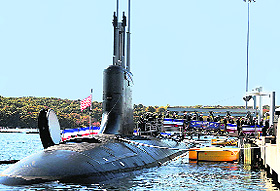 The crew disembarks after taking positions on board for the commissioning of the US Navy attack submarine USS North Dakota in Groton. USS North Dakota is a $2.6 billion attack submarine and is capable of launching Tomahawk cruise missiles, delivering special forces and carrying out surveillance over land and se