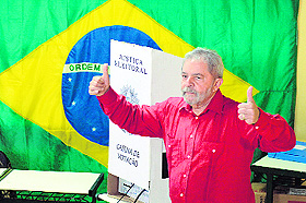 Former president Luiz Inacio Lula da Silva votes during the presidential run-off in Sao Bernardo do Campo on Sunday. 