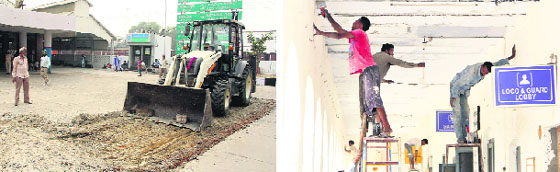 An earthmover levels the ground; and (right) whitewash under way at the railway station in Bathinda on Monday. photos: vijay kumar