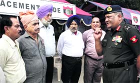 Lt Gen V Menon, Chief of Staff, Western Command (extreme right), interacts with veterans at Chandimandir on Monday.
