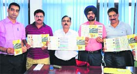 DAV College principal BC Josan (centre), along with other dignitaries, releases the brochure of the Panjab University Inter-Zonal Youth and Heritage Festival on the campus in Sector 10, Chandigarh, on Monday.