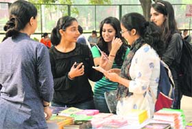 Students at the book fair at MCM DAV College, Sector 36, on Monday.