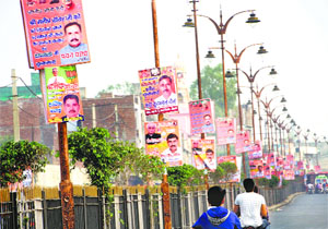 Hoardings along National Highway 10 congratulate newly-elected Chief Minister Manohar Lal Khattar and BJP MLA Manish Grover in Rohtak on Monday.