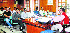 Deputy Commissioner Abhishek Jain presides over a review meeting of the Public Distribution System in Una on Monday. 