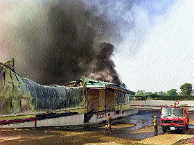 Smoke billows out from Daburs Manakpur plant in the Baddi industrial area on Monday. 