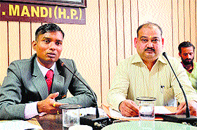 Deputy Commissioner Sandeep Kadam during a press conference in Mandi on Monday