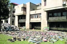 Rare and priceless books salvaged from the floods laid out in the sun in the front lawns of the J&K High Court