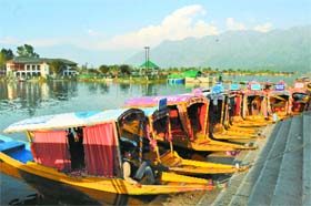 Shikaras wait for customers on the Dal Lake in Srinagar on Monday