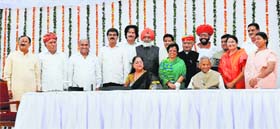 Rajasthan Governor Kalyan Singh and Chief Minister Vasundhara Raje pose for a group photo with newly sworn-in Cabinet Ministers in Jaipur on Monday