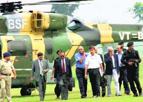 NSA Ajit Doval (2nd from L) arrives to inspect the blast site at Khagragarh in West Bengal