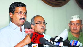 AAP chief Arvind Kejriwal addresses a press conference in New Delhi on Monday as party leaders Prasant Bhushan and Manish Sisodia look on