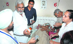 Health Minister Surjit Kumar Jyani at the Rajpura Civil Hospital on Monday. Tribune Photo: JS Virdi