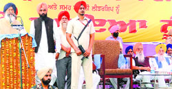 Chief Minister Parkash Singh Badal addresses a gathering at the death anniversary of Darshan Singh Pheruman at Pheruman village near Amritsar on Monday. Tribune photograph