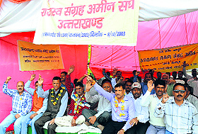 Revenue ameen workers protest in Dehradun on Monday. A Tribune photograph
