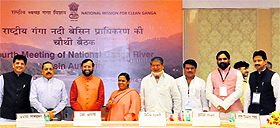 Chief Minister Harish Rawat with Union Water Resources Minister Uma Bharati and other union ministers at a meeting of the National Ganga River Basin Authority in New Delhi on Monday. 