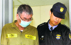 Lee Joon-seok, the captain of the sunken South Korean ferry Sewol, arrives at Gwangju District Court on Monday. AP/PTI