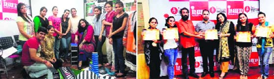 Fashion-designing students create sets using props like newspapers, mirrors and creative concepts at an art-designing workshop.
