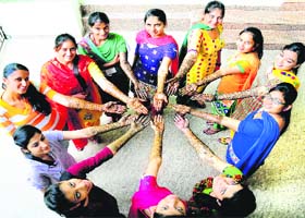 ADDING A DASH OF COLOUR: Girls show their henna-decked hands after taking part in a competition during the 56th Panjab University Inter-Zonal Youth and Heritage Festival at DAV College, Sector 10, in Chandigarh on Tuesday